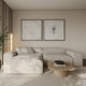 Modern living room with a beige sectional sofa, coffee table, and framed artwork on the wall. The artwork featured is two large abstract canvases with a grey background and etch style marks layered on top