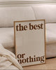 Modern interior with a black floor lamp, white sofa, and motivational sign.