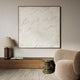 modern living room with a chair and desk, the focal point of the image is a large abstract oak framed canvas