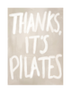 Beige wall art print with white text 'THANKS. IT'S PILATES' on a beige background